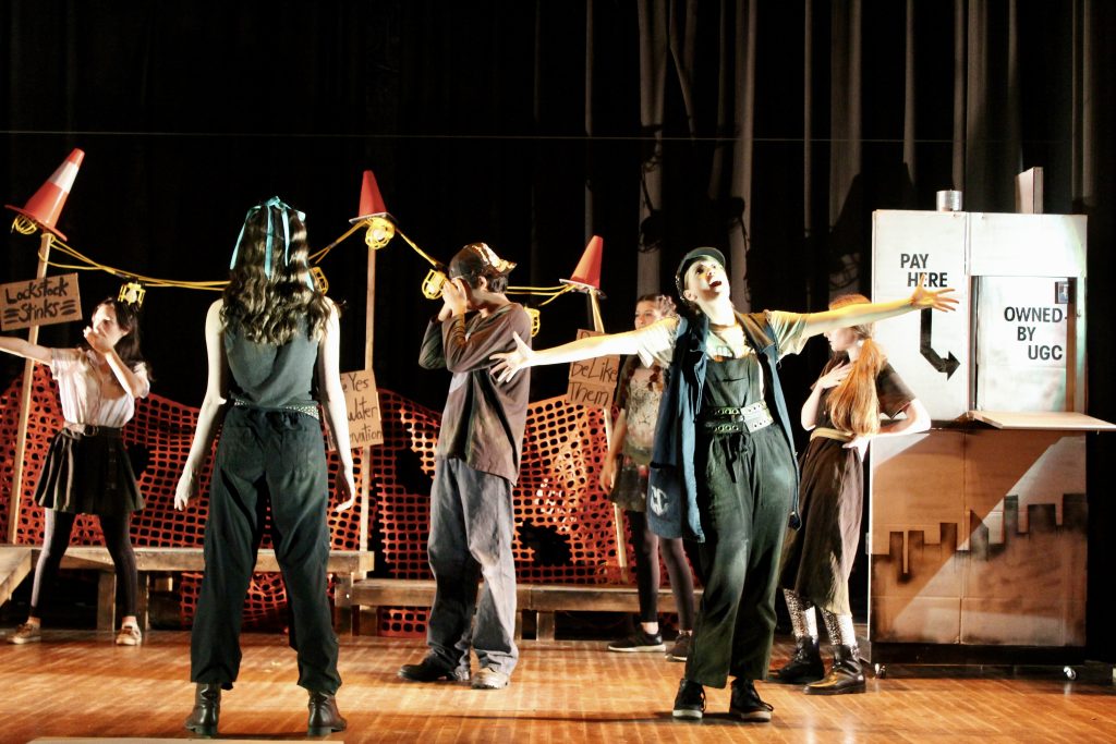 Students performing Urinetown the Musical